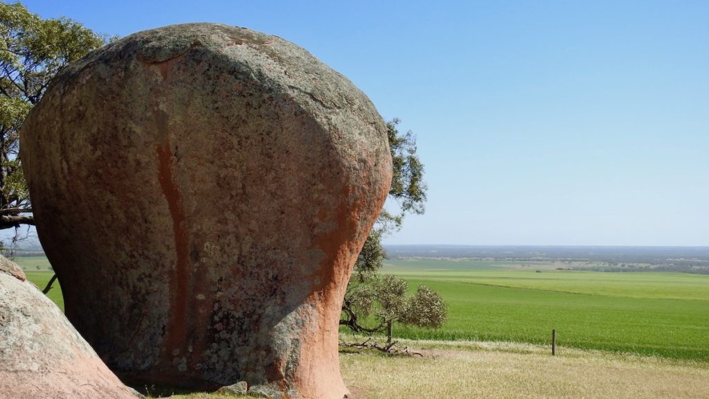 One of Murphy's haystacks (1,500 old boulders), South Australia, with a backdrop of fields. www.gypsyat60.com