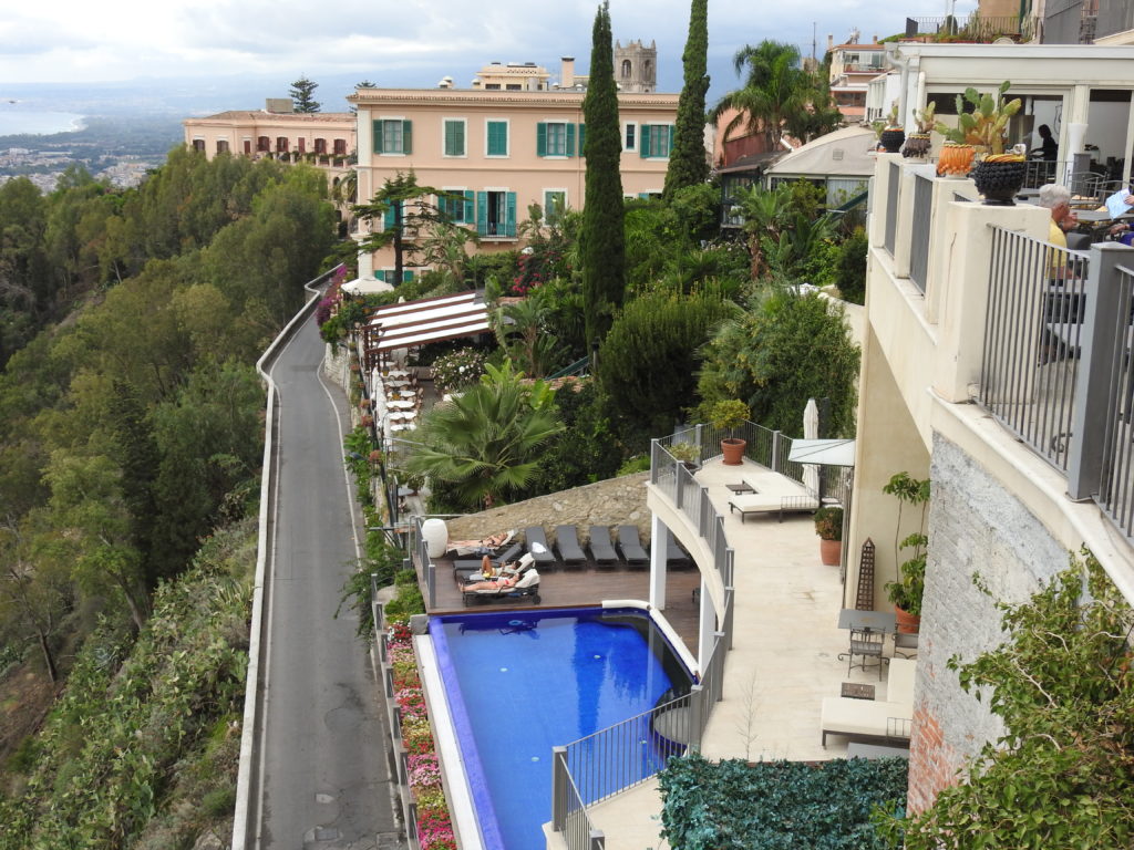 Up market accommodation at Taormina with a pool on the cliff side.