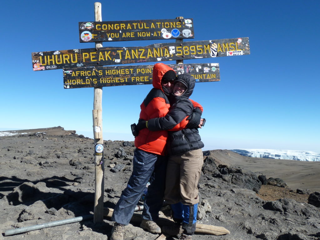 Climbing Mt Kilimanjaro - a hug at the summit