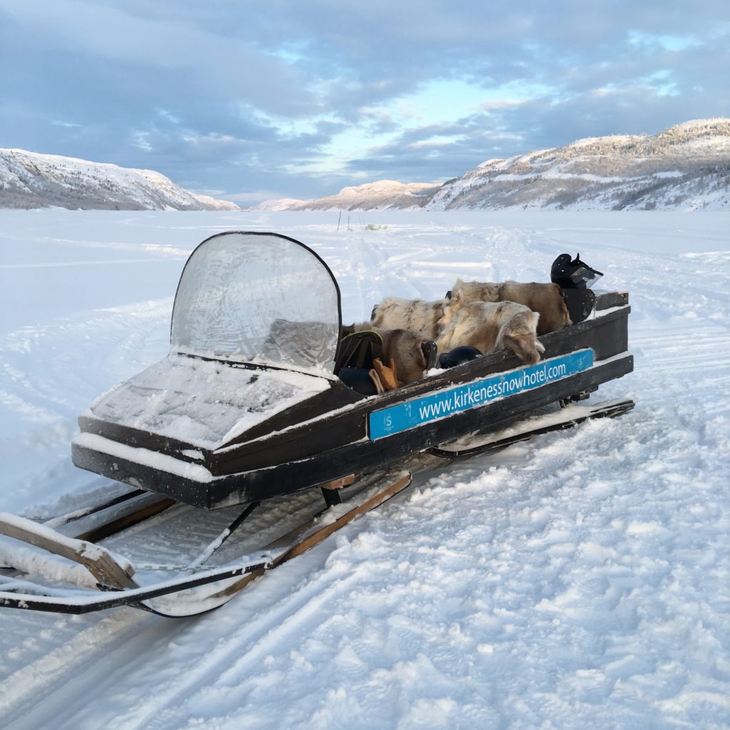 Sledge towed behind Snowmobile to reach the Arctic King Crab fishing hole. Reminder skins on seats helped to keep backsides warm. Kirkenes, Finland. 