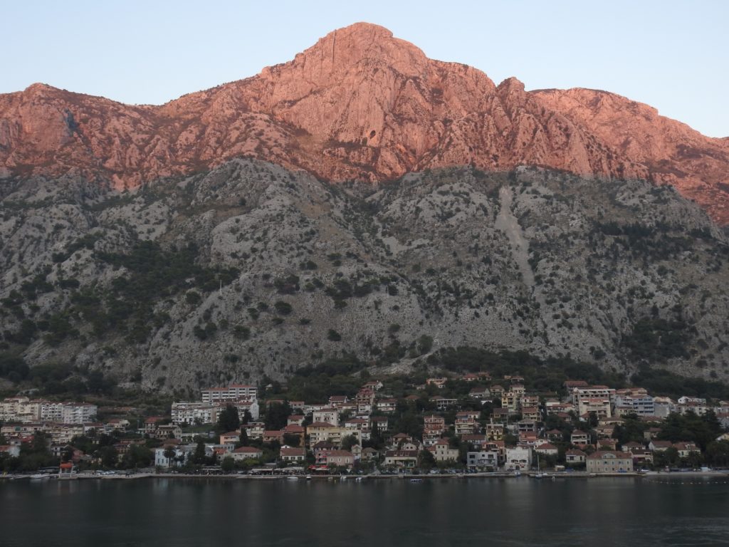 Sunset at Kotor starting to colour the mountains pink. www.gypsyat60.com