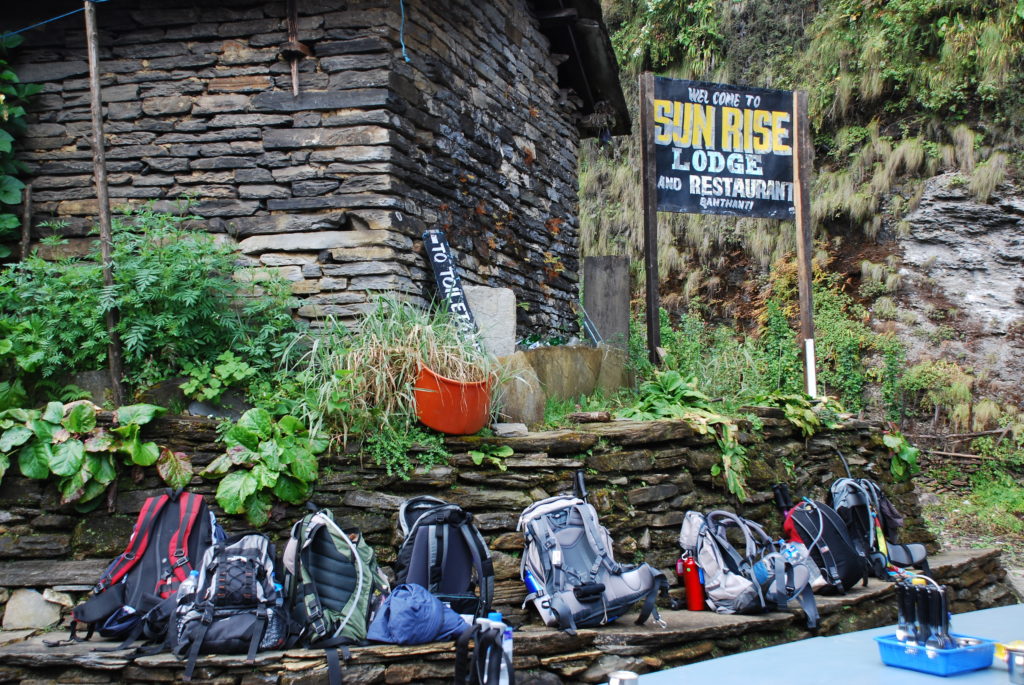 Backpacks belonging to trekkers outside Nepalese tea house. www.gypsyat60.com