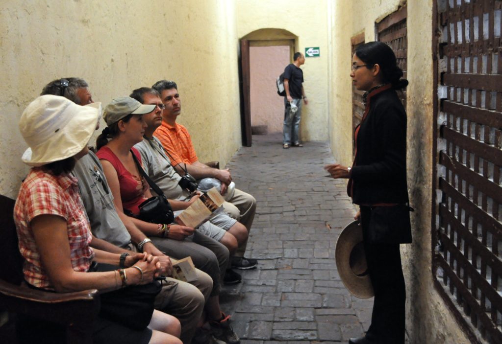 Tour Guide giving local knowledge at Saint Catalina Monastery, Araquipa, Peru, South America. www.gypsyat60.com