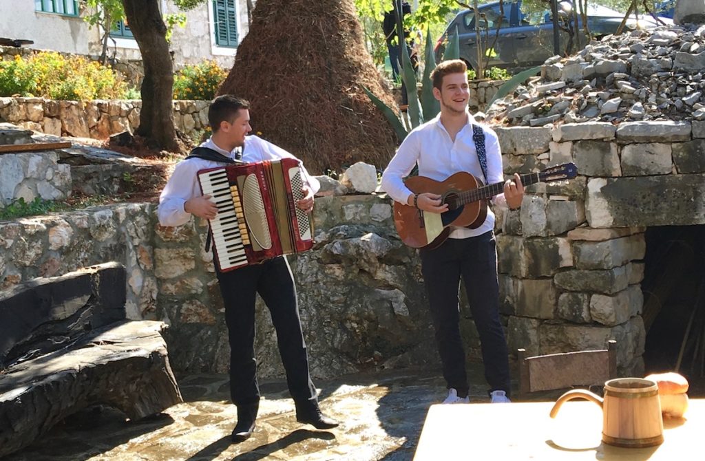 Entertainment by the local lads in the Court at Jurlinovi Dvori, Croatia. www.gypsyat60.com