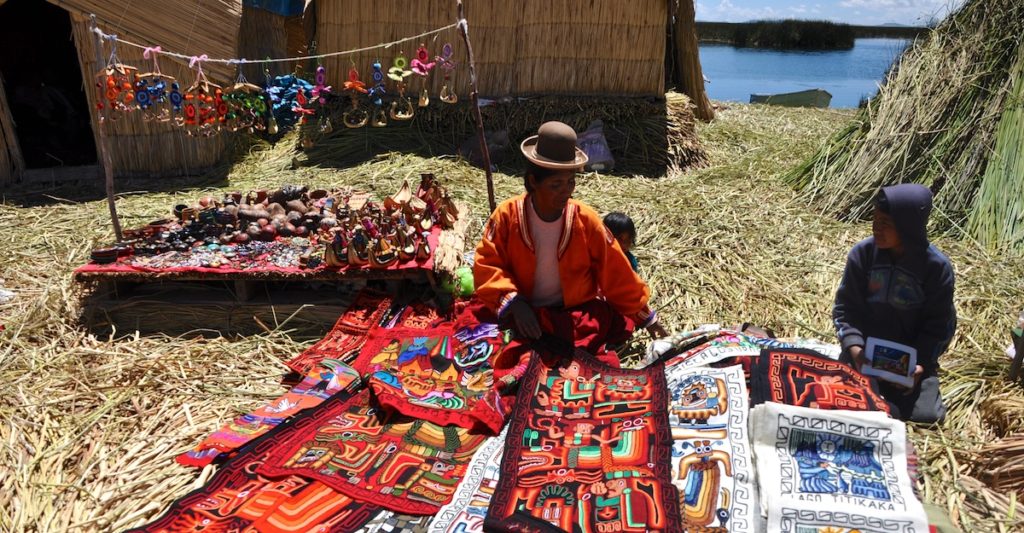 Local lady selling handmade souvenirs on the Reed Islands, Lake Titicaca. www.lgypsyat60.com