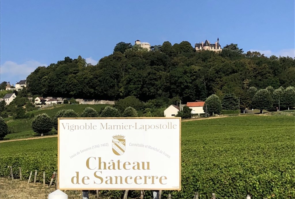 Cycling past Chateau de Sancerre, Loire Valley. www.gypsyat60.com