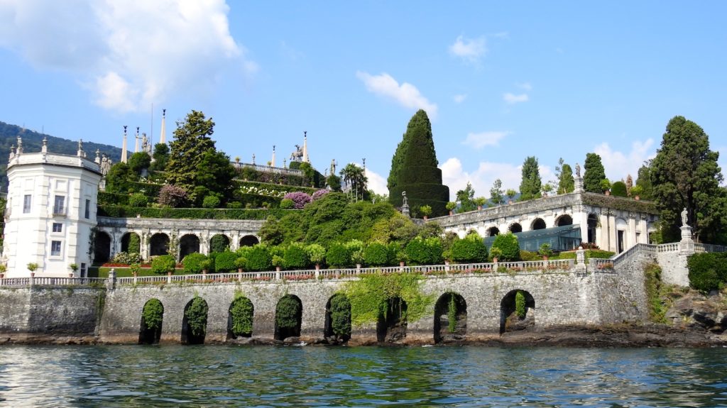 Boating around Isola Bella, Lake Maggiore, to take in the magnificence of the palace and gardens. www.gypsyat60.com