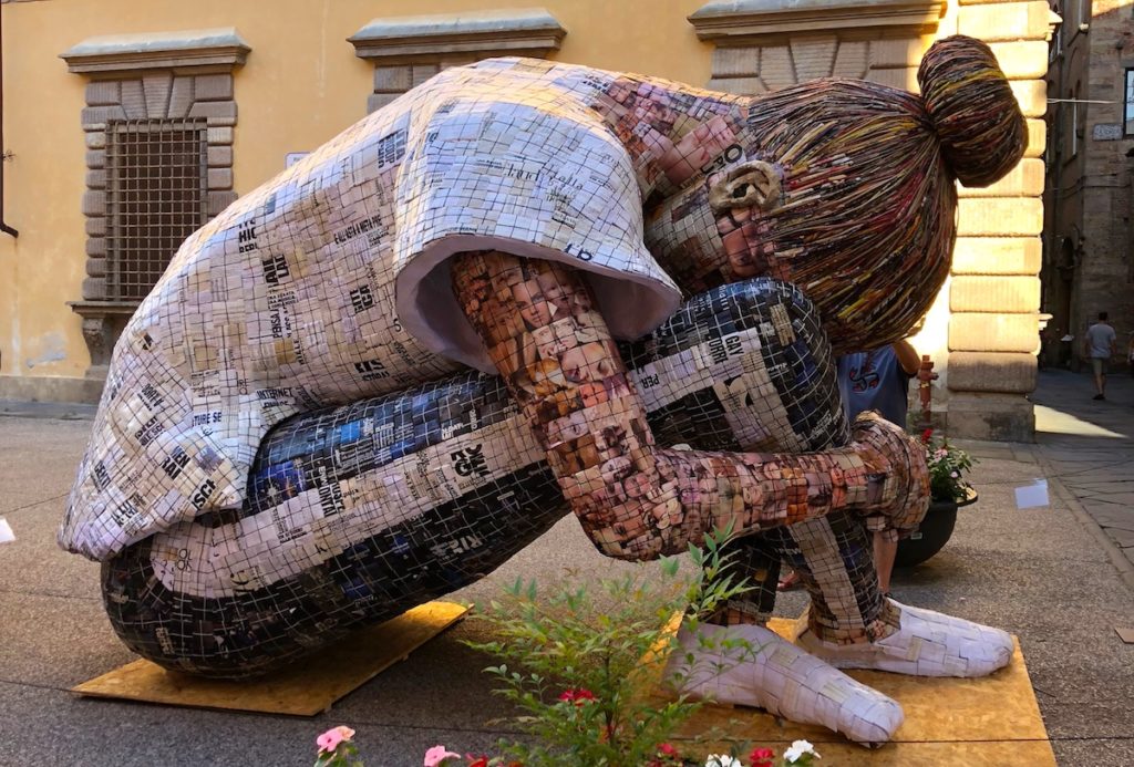 Sculpture of a teenage girl in the International Paper Exhibition, Lucca Italy, 2018. Sculpture is made up in squares of newspaper stores, photographs etc. The artist - Manuela Granziol (Swiss). www.gypsyat60.com