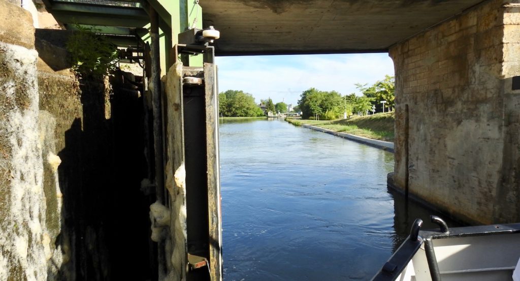 Coming out of a lock on the Briare Canal, Loire Valley, France. www.gypsyat60.com