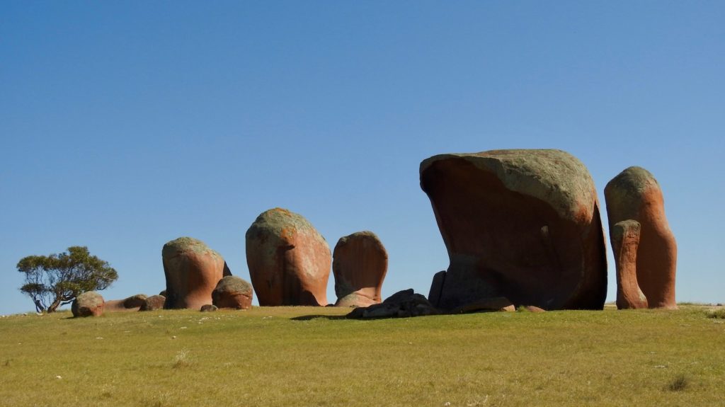 Murphy’s Haystacks, ancient wind-worn pink granite boulders that formed 1500 million years ago. Location is approx.. 40km south of the popular fishing and tourist town of Streaky Bay on South Australia’s Eyre Peninsular, they stand like crooked haystacks on a hilltop surrounded by wheatfields just 2km off the Flinders Hwy. www.gypsyaty60.com