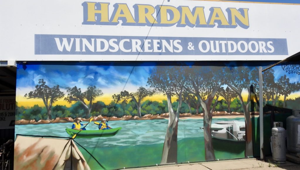 A brilliant mural at Moree, NSW, advertising "Hardman Windscreens and Outdoors". Set on the banks of the river, highlighting the blood of the Moree community. www.gypsyat60.com